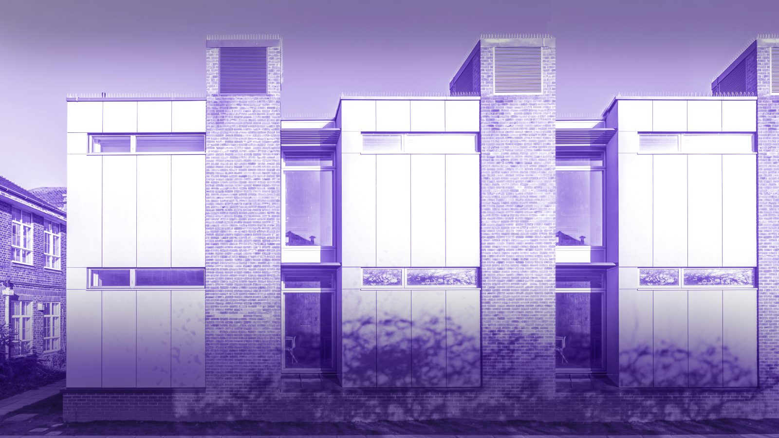 Photo of architectural extension to a school building in Brighton & Hove. Extension includes low energy design features including shading and ventilation towers. Stickland Wright Architecture and Interior Design